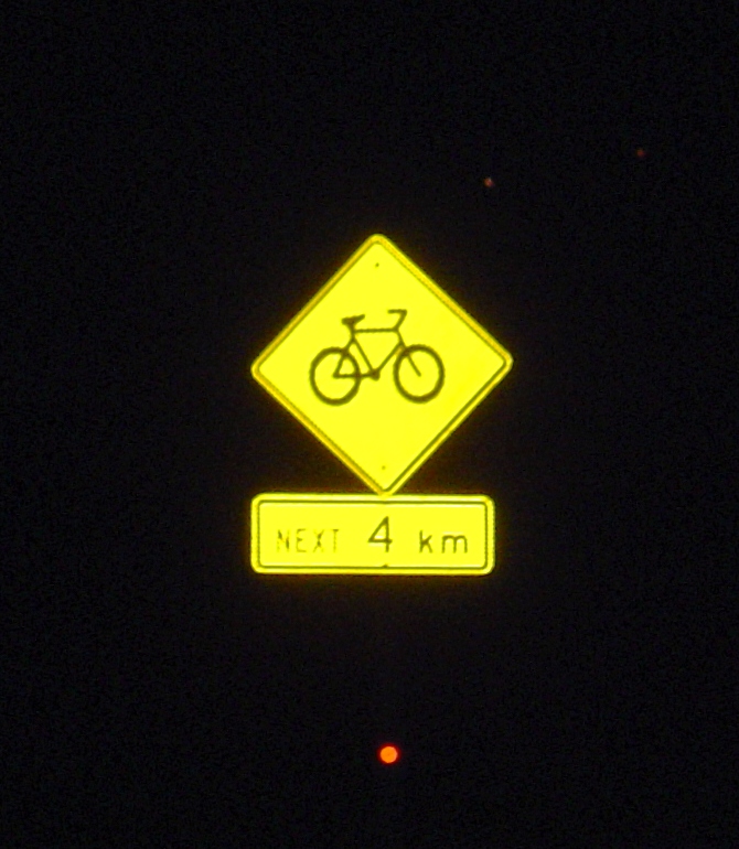 road sign at night